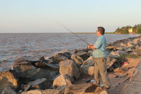 After a hard day’s work, Marcio says he likes fishing during the high tide at the Kingston Seawall. Sometimes he catches something, other times he doesn’t but the process helps to clear his mind.