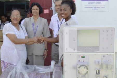 From left: Tara Mohamdee handing over the Dialysis Machine to representatives of the Georgetown Public Hospital Corporation (GPHC). From  right are Nurse in charge of the Renal Department at the GPHC, O’Delevana Kennedy, and CEO of the GPHC Michael Khan with another representative from the hospital. (GINA photo)
