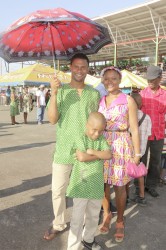 A Guyanese family, fully decked out in African wear, catch some shade during yesterday’s celebrations 