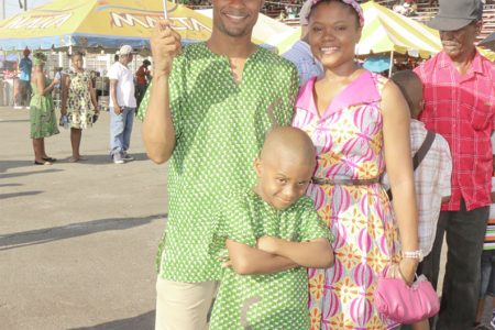 A Guyanese family, fully decked out in African wear, catch some shade during yesterday’s celebrations
