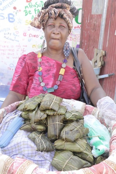 A conkie seller displays her abundant supply at the Emancipation Festival at the National Park. (Photo by Arian Browne) 