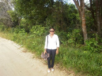 Onecia Schadde, a resident of Lima Sands walking along the trail going home