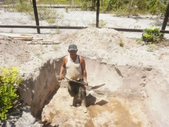 Rickey Jospeh digging a pit