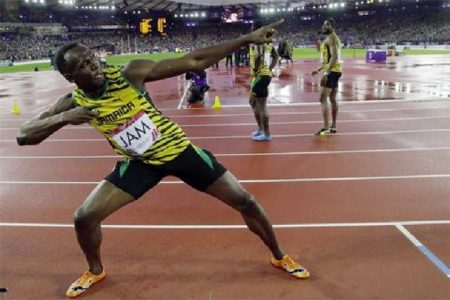 Jamaica’s Usain Bolt poses after Jamaica won the men’s 4x100m relay final at the 2014 Commonwealth Games in Glasgow, Scotland,  yesterday.CREDIT: REUTERS/SUZANNE PLUNKETT