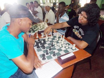 Anthony Drayton and Taffin Khan battle it out during a recent chess tournament. They are both participants in the Tromso Olympiad and are playing for Guyana starting yesterday. The Olympiad lasts for two weeks.