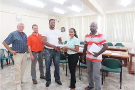 Senior Environmental Officer at EPA,  Bibi Sharief (second from right) presented contracts to the Project Contractor, Alvin Chowramootoo (right), and IECS Representative, Deoraj Dalchand (centre) for Supervision of the Project. Also in this ministry photo, from left, are Ben ter Welle (Team Leader, GFA Consulting Group), and Joel Breems (Protected Areas Commission Representative).
