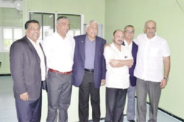 Minister of Health Dr. Bheri Ramsaran (third from right) along with Dr. Narendra Singh (second from right) and the Kissoon brothers.  (GINA photo)