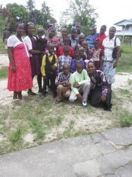 All of us! My mother, extreme right with her six daughters and sixteen grandchildren after church