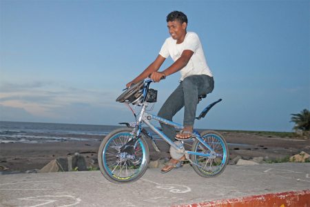 Sound waves: This young man was spotted by SN photographer Arian Browne riding his bicycle complete with its own sound system along the Kitty sea wall yesterday.