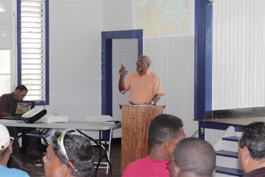 Do I hear a bid? Ron Robinson conducting the auction yesterday (Ministry of Natural Resources photo) 