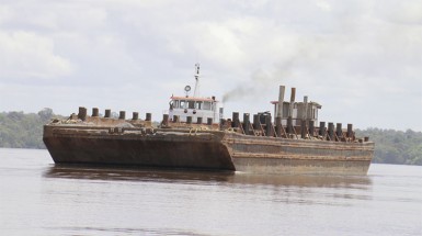 A barge transporting Vaitarna logs 