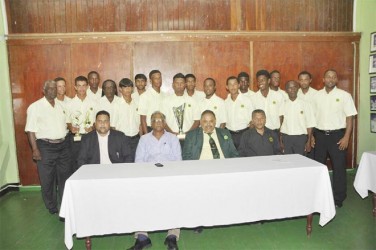 The Guyana team (standing) with GCB officials and Director of Sport Neil Kumar seated second from left. 