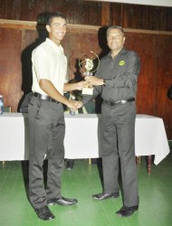 Tagenarine Chanderpaul receiving the MVP award from GCB secretary Anand Sanasie.