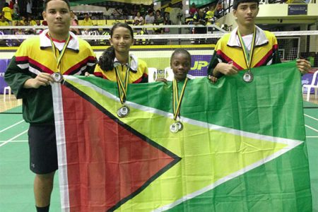 The Guyana players with their medals and the Guyana Flag.