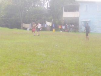 Playing football in the rain