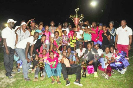 The Police Progressive Youth Club track and field outfit posing with the winner’s Boyce/Jefford Classic Trophy. (Orlando Charles photo)