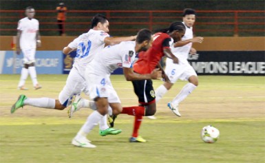 Alpha United’s Gregory `Jackie Chan’ Richardson on the go in the match against Club Deportivo Olimpia. (Orlando Charles photo) 