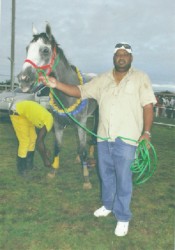 Dennis Deoroop and champion race horse, Score’s Even.  