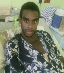 An injured Terrance Phillips resting at the Georgetown Public Hospital on Tuesday. 