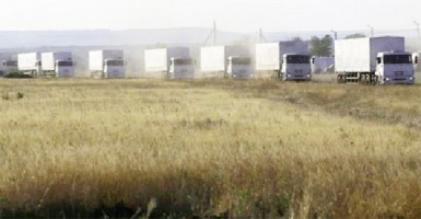 Trucks of a Russian convoy carrying humanitarian aid for Ukraine drive before parking at a camp near Donetsk located in Rostov Region, August 21, 2014. REUTERS/Alexander Demianchuk 