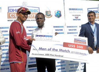 Sunil Narine receives the Man of the Match prize from Grenada PM Dr. Keith Mitchell during the 2nd Dhaka Bank ODI West Indies v Bangladesh at Grenada National Stadium, St. George’s, Grenada  yesterday. WICB Media Photo/Randy Brooks