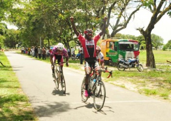 Team Coco’s Hamza Eastman celebrates after edging Robin Persaud (right) and Marlon Williams to win the feature 35-lap event of yesterday’s 11-race Malta Supreme 11-race programme. (Orlando Charles photo) 