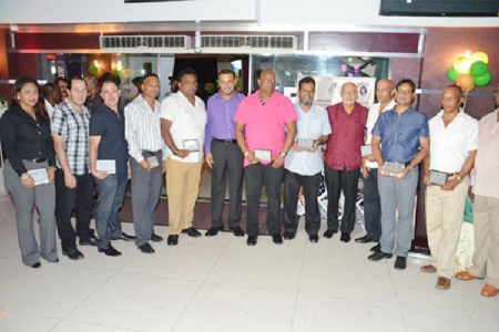 Mining sector awardees with President Donald Ramotar (fourth from right) and Minister of Natural Resources and the Environment, Robert Persaud (GINA photo)
