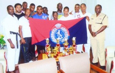 The Guyana Police Force Karate team with the Force Training Officer, Senior Superintendent Paul Williams in Police uniform (far right). 