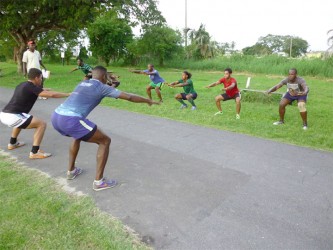 ON THE ROAD TO MEXICO! The national rugby sevens squad under the watchful eyes of Barrington Browne doing fitness drills at the National Park yesterday. 