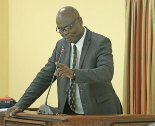 Lieutenant Colonel Sydney James makes a point from the witness stand yesterday during the Walter Rodney Commission of Inquiry