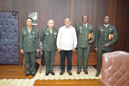 Brazilian military officials yesterday called on President Donald Ramotar (centre)  at the Office of the President. From right to left are: Brigadier Bruce Lovell of the Guyana Defence Force (GDF),  Chief of Staff of the GDF, Brigadier Mark Phillips, Lieutenant General Decio Luis Schons and another official of the Brazilian Ministry of Defence. (GINA photo)
