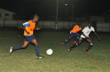 Shaquille Agard (left) of the Golden Jaguars Provisional squad in the process of playing a through pass which led to Delroy Fraser’s opening goal 