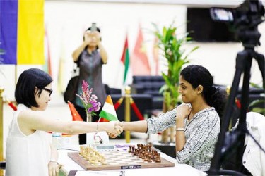 China’s Hou Yifan (left) and India’s Harika Dronavalli clashed at the FIDE Women’s Grand Prix tournament in Sharjah, UAE. The game ended in a draw. Harika and another Chinese player Ju Wenjun are tied for the lead after three rounds in the eleven round tournament. 