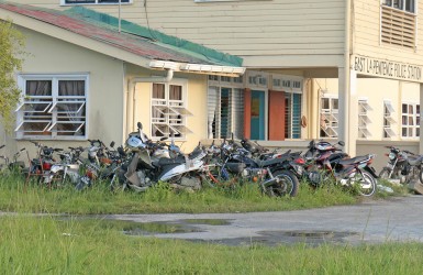 A large number of seized motorcycles packed up at the side of the East Ruimveldt Police Station.