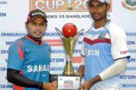 Captains Mushfiqur Rahim (left) and Denesh Ramdin pose with the series trophy yesterday. 