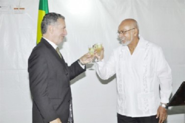 President Donald Ramotar (right) and Brazilian Ambassador Lineu Pupo de Paula toast to Brazil’s Independence Day anniversary (GINA photo) 