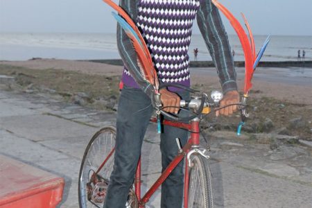 Heritage style? This young man was seen on the seawall at Kingston yesterday with his bicycle decked out with feathers. (Photo by Arian Browne)