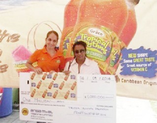 An ANSA employee (left) poses with one of the winners 