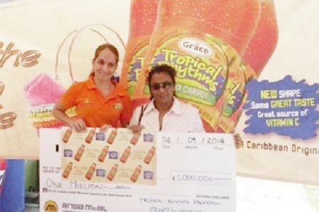 An ANSA employee (left) poses with one of the winners
