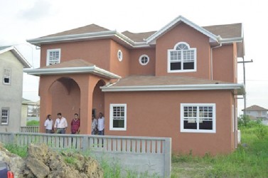 Private sector members in one of the high income turn-key homes in Eccles  (GINA photo)