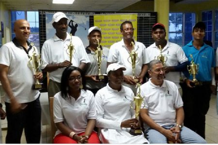 In picture with trophies from left to right back row Pur Persaud, Mohanlall Dinanauth, Rishi Sukhram, Patrick Prashad, Mahendra Bhagwandin, Avinda Kishore and Ian Gouveia.
Seated with trophy Juliet Prince, without trophy Courts representative, Kenneth Scrub, standing and Roberta Ferguson and Clyde De Haas sitting.