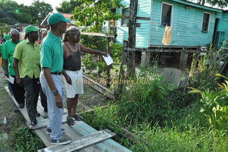 David Granger (left) being given a tour of the area (APNU photo)