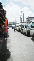 Buses waiting for passengers at the Mahaica Bus park yesterday  morning. 