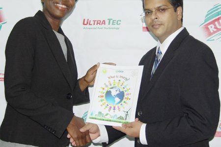 This RUBIS photo shows Rhonda Johnson receiving a copy of the booklet from Dr Mahender Sharma