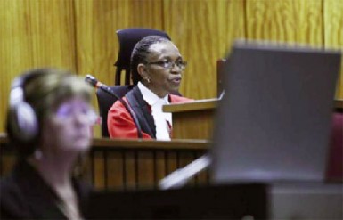 Judge Thokozile Masipa delivers her judgment in the trial of Olympic and Paralympic track star Oscar Pistorius at the North Gauteng High Court in Pretoria, September 11, 2014. REUTERS/Phill Magakoe/Pool