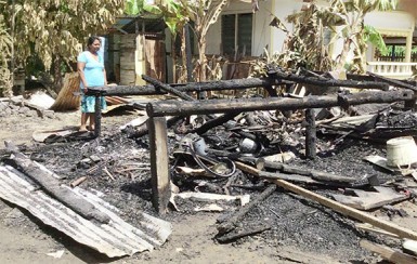 The charred remains of Fazim Ally Asgar’s home  