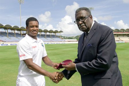 Leon Johnson, the 300th  West Indian to play test cricket receives his cap from the legendary former West Indies skipper Clive Hubert Lloyd yesterday. (Photo courtesy of WICB media)
