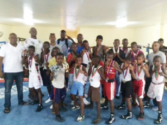 Boxers and officials pose for a photo opportunity yesterday following the conclusion of the Guyana Amateur Boxing Association Demerara Distillers Limited-sponsored U16 boxing championships at Andrew `Six Head’ Lewis Gym.