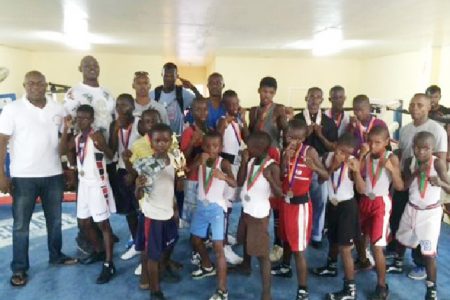 Boxers and officials pose for a photo opportunity yesterday following the conclusion of the Guyana Amateur Boxing Association Demerara Distillers Limited-sponsored U16 boxing championships at Andrew `Six Head’ Lewis Gym.