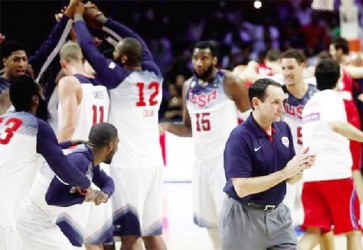 Coach Mike Krzyewski (R) of the U.S. celebrates winning their Basketball World Cup final game against Serbia in Madrid Sunday night. CREDIT: REUTERS/SERGIO PEREZ